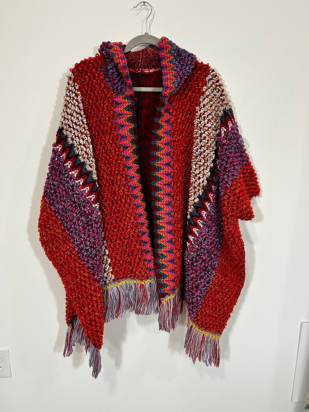 Vibrant Hooded Poncho with super cool knit pattern and fringe. ONE SIZE